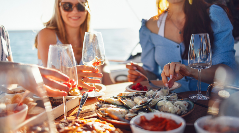 Elegant plated gourmet dishes on a luxury cruise ship table setting