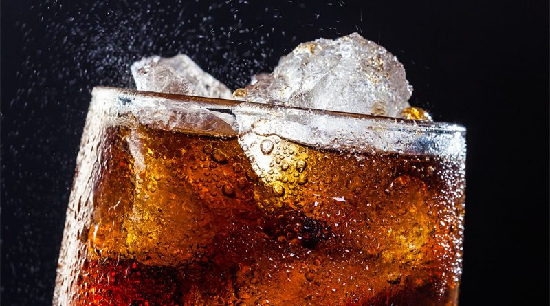 Classic Coca-Cola colored liquid in glass with ice to support Diet Cherry Coke return article