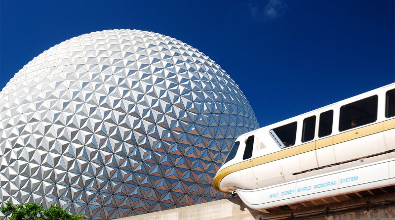 Walt Disney World monorail passing in front of EPCOT’s Spaceship Earth on a clear day