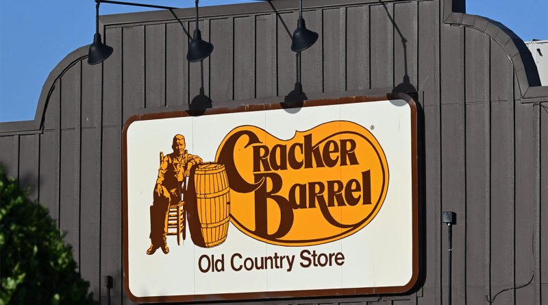 Cracker Barrel restaurant exterior with the restored Old Timer logo sign