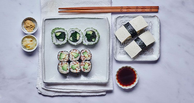 arious forms of sushi, a traditional Japanese dish featuring vinegared rice combined with other ingredients.