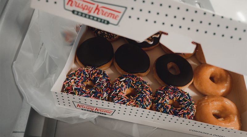 Krispy Kreme Fall Fair Collection doughnuts featuring cotton candy, caramel churro, apple pie, and kreme puff flavors