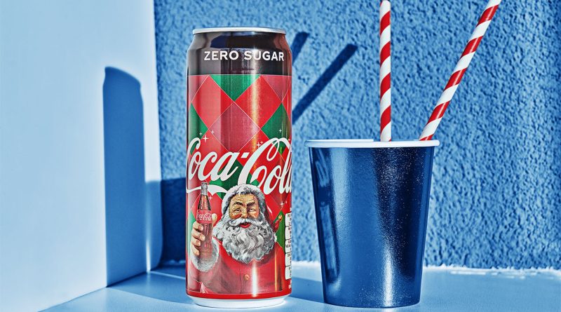 Limited edition Coca-Cola Holiday Creamy Vanilla bottles with seasonal packaging on a festive table