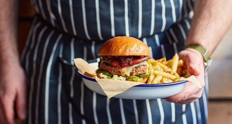 a beef burger and rosemary salted chips from the British casual dining chain Honest Burgers.