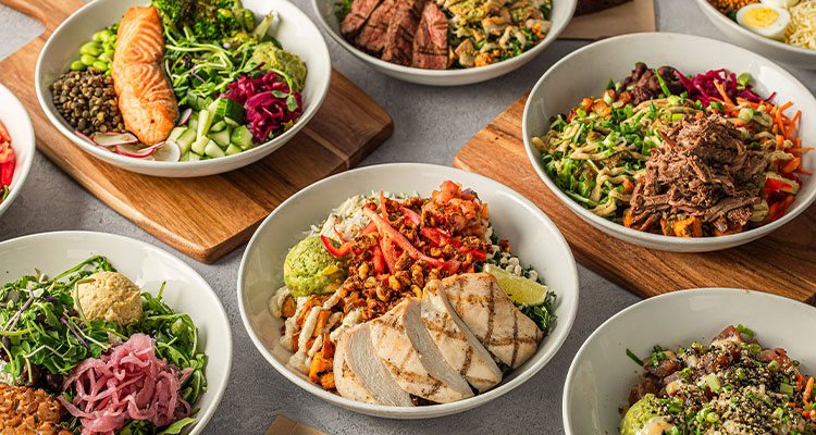 a variety of customizable, healthy salad bowls from Impact Kitchen catering.