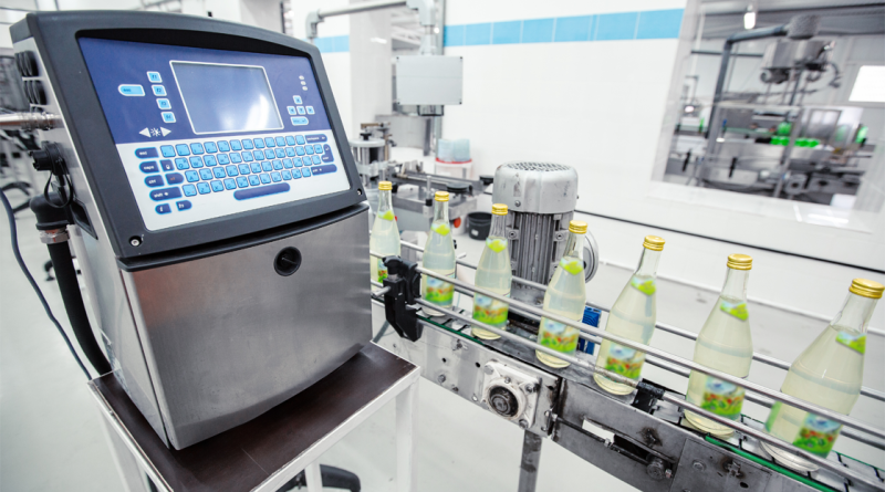High-tech labeling machine in a modern beverage production facility ensuring efficient bottle labeling process